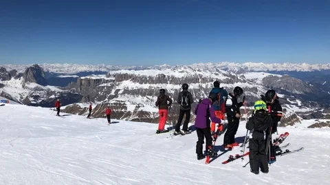 Groups of tourists skiing on the Dolomites at high altitude Stock Footage 106410372