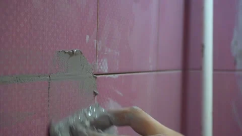 Grouting ceramic tiles, close up. Stock Footage 96756376