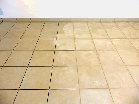 Grouting floor tiles Stock Photos