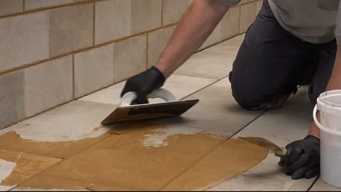 Grouting stone tiles Stock Footage 111865754