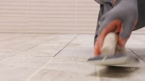 Grouting tiles closeup Stock Footage 111865473