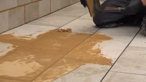 Grouting tiles on the floor Stock Footage 111865987