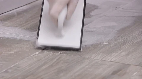 Grouting tiles Stock Footage 111860762