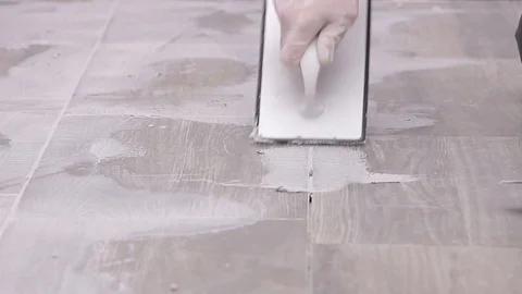 Grouting tiles Stock Footage 111860770
