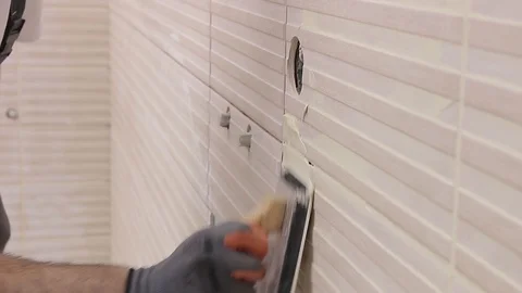 Grouting tiles Stock Footage 111865329