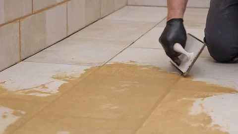 Grouting tiles Stock Footage 111866012
