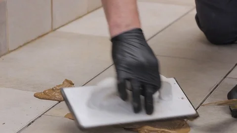 Grouting tiles Stock Footage 111866035