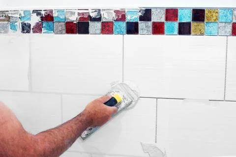 Grouting tiles Stock Photos