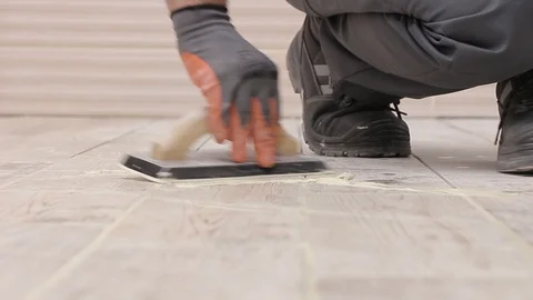Grouting tiles from shot Stock Footage 111865567