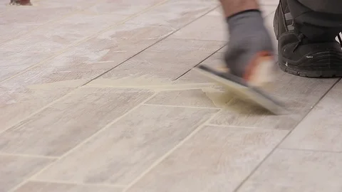 Grouting wooden tiles Stock Footage 111865530