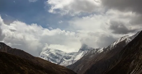 Growing clouds in mountain valley Stock Footage 79581634