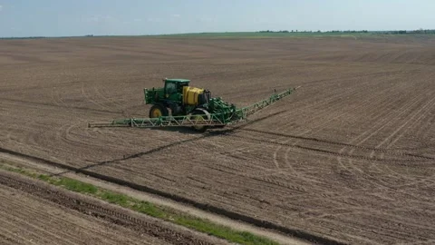 Growing cultivating vegetables. tractor pulls barrel with irrigation system Video stock 230702041