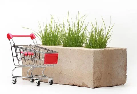 Growing grass made of bricks on a white background Stock Photos