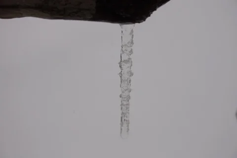 Growing icicle during snowfall. Timelapse Stock Footage 108406327