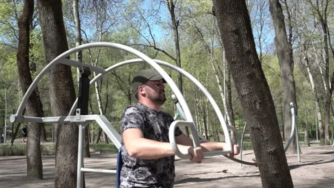 A grown man does on the street simulator 4K Stock Footage 90682856