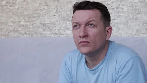 A grown man looks in front of him. The slow motion effect. Vídeo Stock 129036414