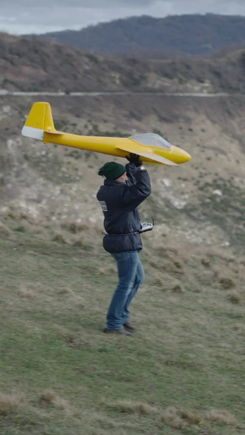 A grown man prepares his plane for flight Stock Footage 273601414