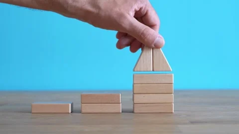 Growth, target, upskill concept. Growth of wooden cubes on a clean background Stock Footage 240209993