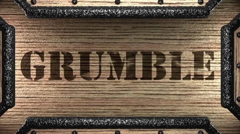 Grumble on wooden stamp Stock Footage