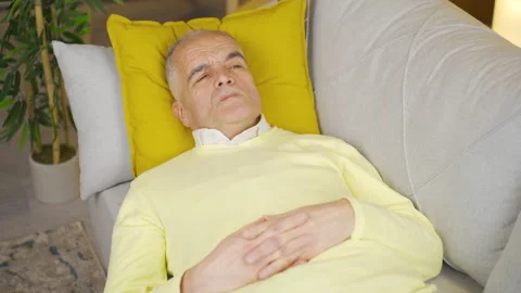 Grumpy and senile old man is bored at home. Video stock 235612386