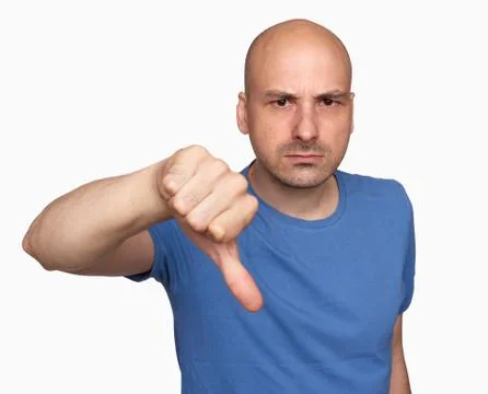 Grumpy bald man gesturing his thumb down Stock Photos