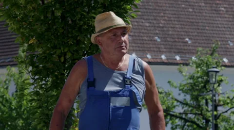 Grumpy blue-collar worker turns around Stock Footage 33036734