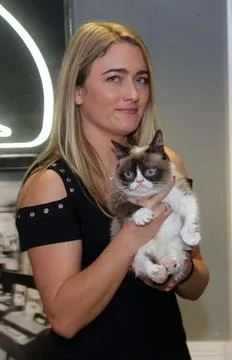 Grumpy Cat Meet And Greet Event At Hmv Oxford Street London. Grumpy's Owner Taba Stock Photos