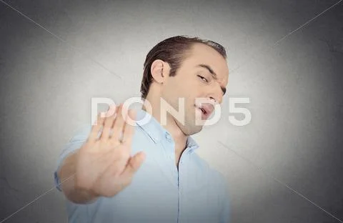 Grumpy man with bad attitude giving talk to hand gesture Stock Photos