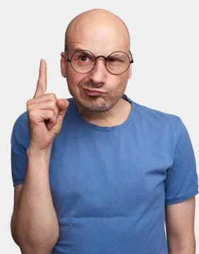 Grumpy man raised forefinger Stock Photos