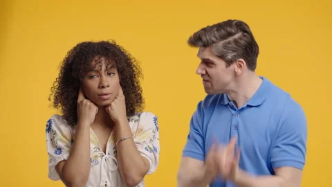 Grumpy Man Scolds On African American Woman. Irritated Girlfriend Covered Ears Stock Footage 322197808