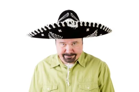 Grumpy middle aged man in Mexico sombrero hat Stock Photos