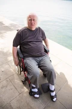 Grumpy Old Man In Wheelchair Stock Photos