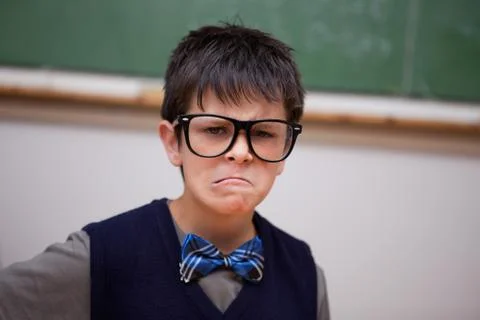 Grumpy schoolboy posing Stock Photos