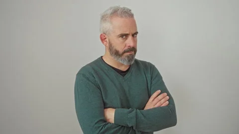Grumpy young man sporting a sweater, looking skeptic and nervous, frowning .. Stock Footage 277435981