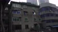 Grundgy Apartment Building Rainy Day In Chengdu China 4k or 4k+ Resolution