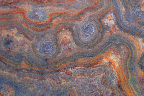 Grunge background: curly rust on an old metal surface, toning Stock Photos