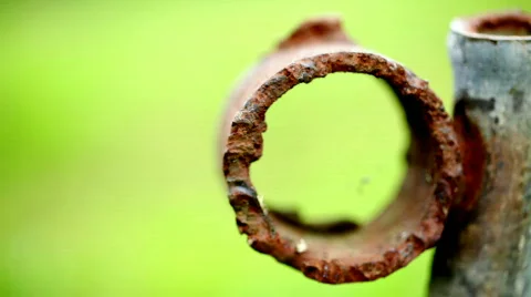 Grunge background / Old rusty iron pipe &amp; green background Stock Footage 824194