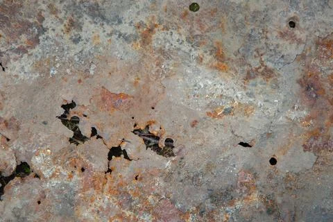 Grunge background: rust on an old painted metal surface, holes from through c Stock Photos