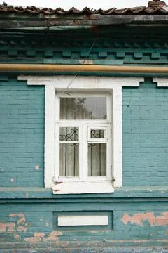 Grunge brick wall with a small  window Stock Photos