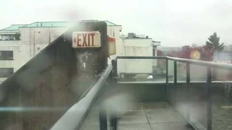 Grunge Exit Sign In Rain Stock Footage 12583611