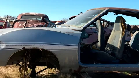 Grunge footage. Outdated car. Scrap cars background. 스톡 동영상 257653056