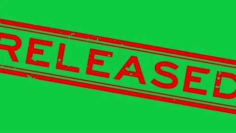 Grunge red released word square rubber seal stamp zoom on green background Stock Footage 199816173