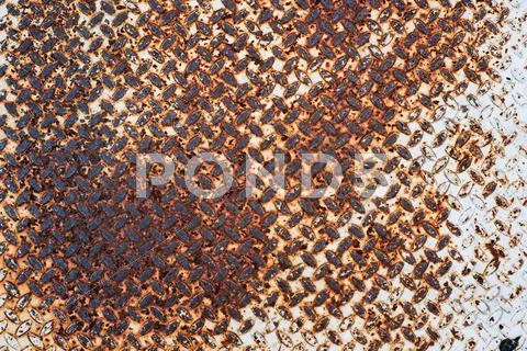 Grunge rusty diamond metal plate background Stock Photos