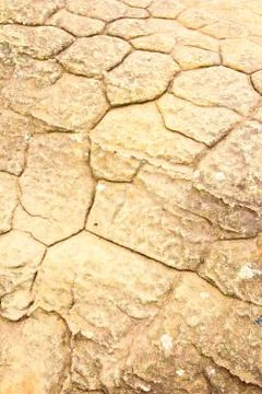 Grunge texture of cracked stone surface Stock Photos