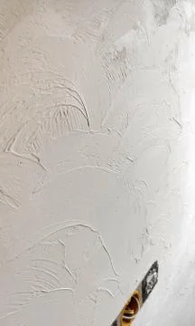 Grunge texture of light decorative plaster or concrete as a background. Abstr Stock Photos