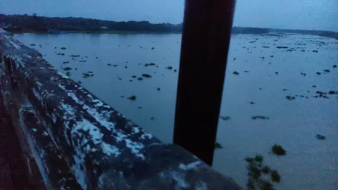 The grunge wall bridge wall against river water and the blue-toned night li.. Stock Footage 324904411