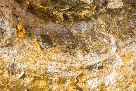 Grunge worn gold leaf background texture Stock Photos