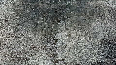 Grungy concrete wall texture with dark weathered stains Stock Footage 336933856