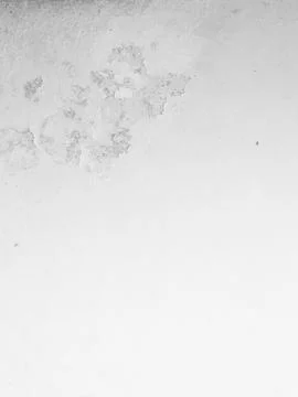 Grungy white wall texture with old faded stains and rough surface Stock Photos