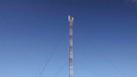 GSM Antenna on a blue sky background Stock Footage 88309897